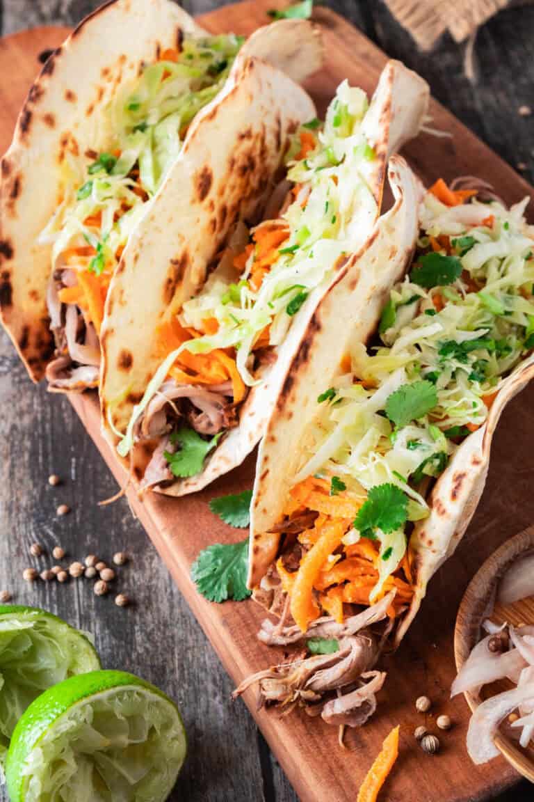 Pulled Lamb Tacos with Pickled Shallots, Cabbage Slaw, and Carrot Salad