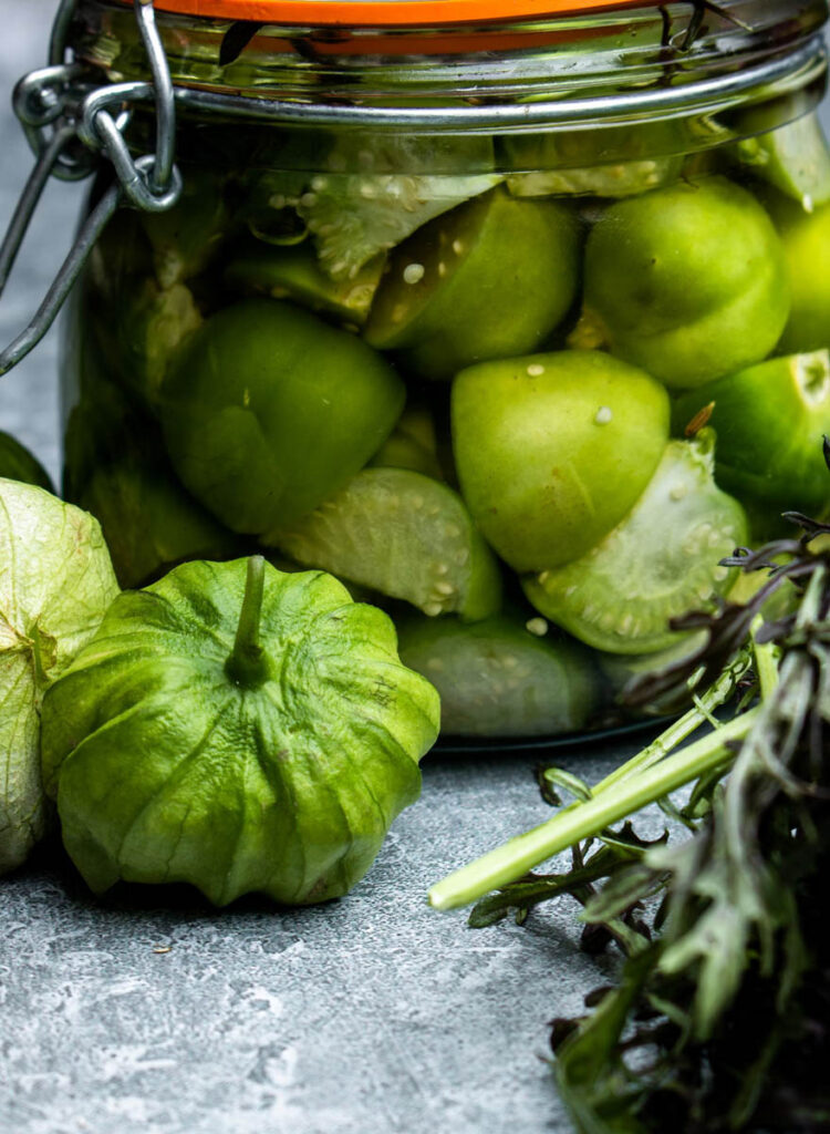 Pickled tomatillos in jar.
