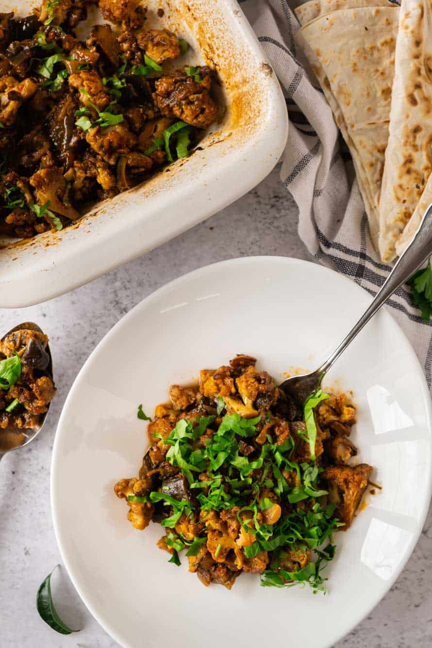 Vadouvan cauliflower and eggplant in bowl and casserole.