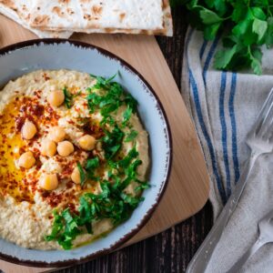 Vadouvan Hummus in Bowl with Bread.
