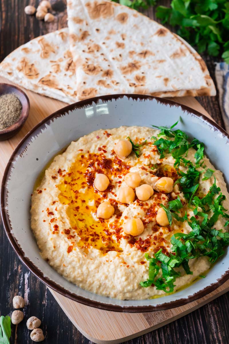 Vadouvan Hummus in Bowl with Bread.