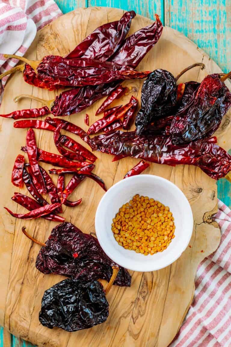 Dried chiles on a cutting board.