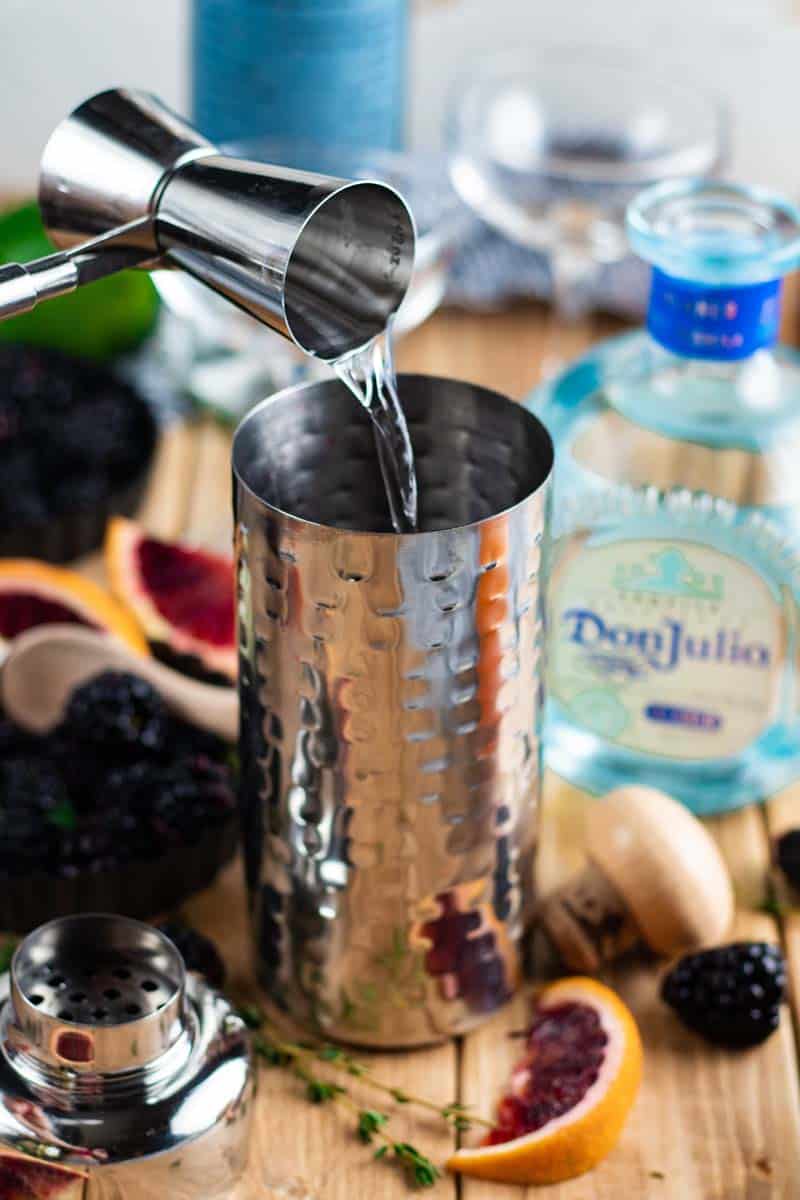 pouring tequila in cocktail shaker