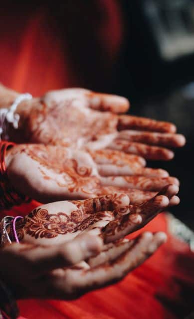 Hands with mehndi designs.