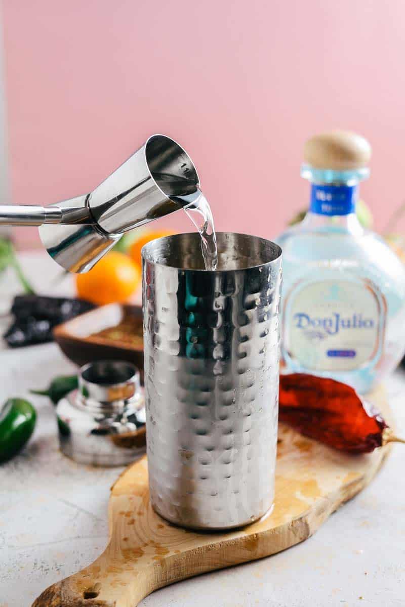 pouring Tequila into a cocktail shaker