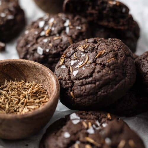 chocolate caraway cookies on a surface