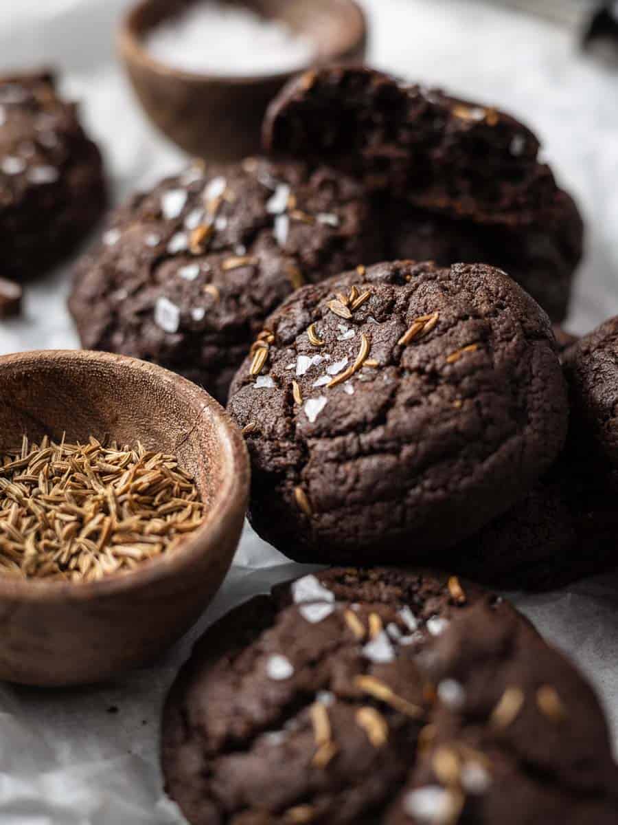 chocolate caraway cookies on a surface