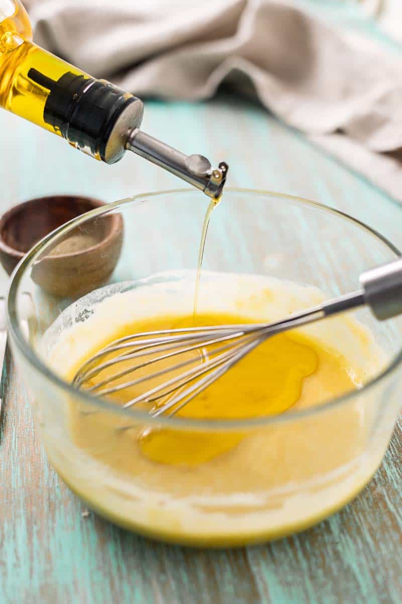 emulsifying egg yolks and olive oil