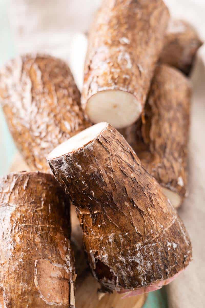 raw yuca or cassava on a cutting board
